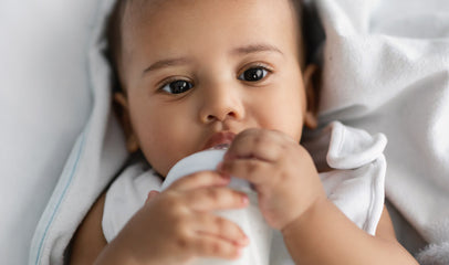 baby drinking milk from milk bank