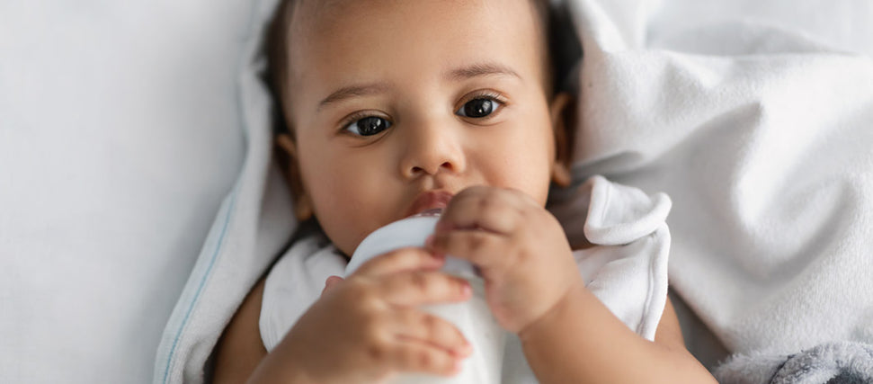 baby drinking milk from milk bank