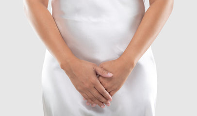 woman covering crotch area due to bacterial vaginosis