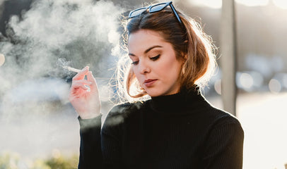 woman smoking on the street