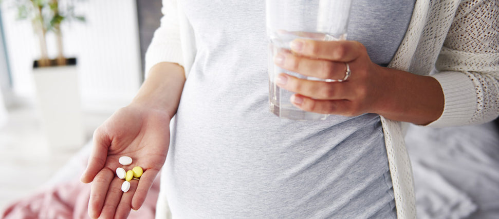 woman holding handful of nursing supplements 