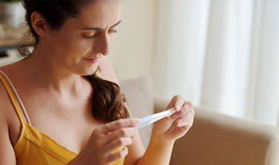 woman looking at ovulation test