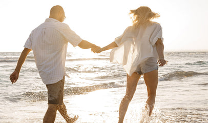 TTC couple on beach during summer travel