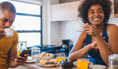 couple waiting at home eating breakfast