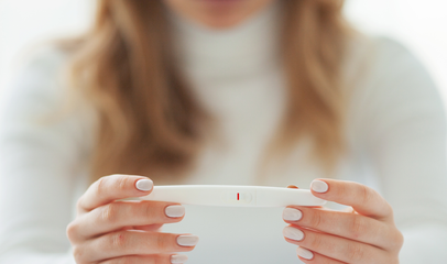 woman holding ovulation test