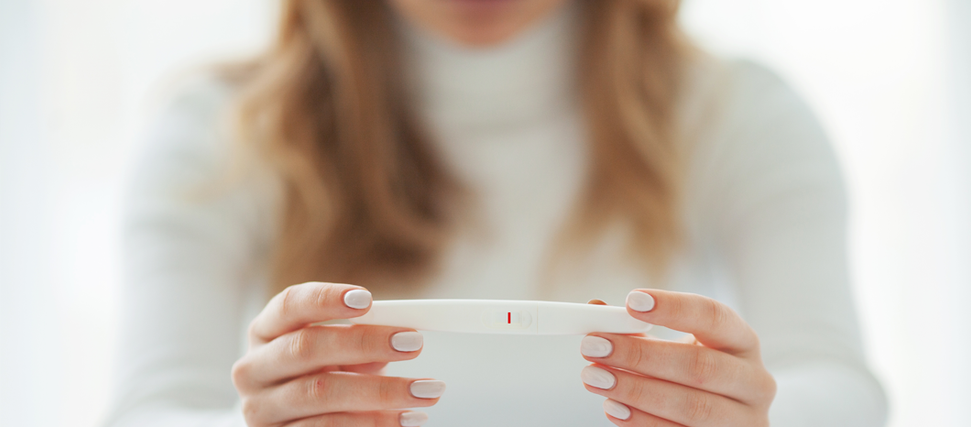 woman holding ovulation test