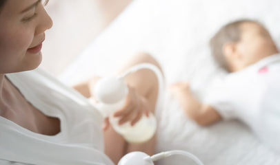 woman pumping breastmilk for baby